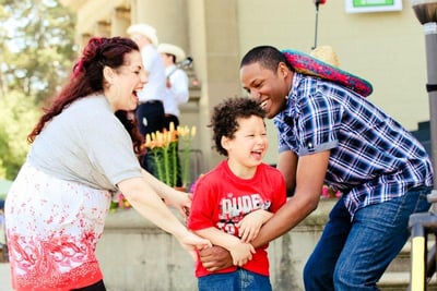 Family laughing and playing