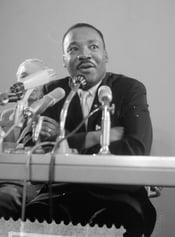 Dr. Martin Luther King Jr at a press conference in 1964