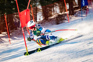 PA Virtual female student in bright outfit skiing in competition