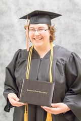 lexi grad with diploma