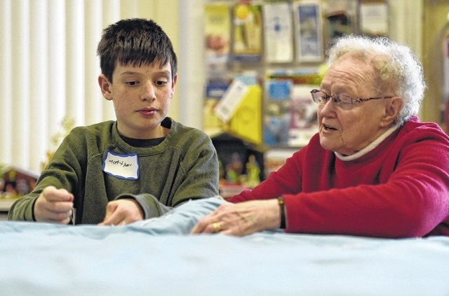 Plymouth Active Adult Center and PA Virtual create charitable sleeping bag from discarded quilt